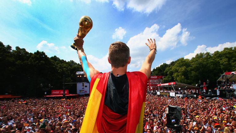 Bastian Schweinsteiger shows off the World Cup