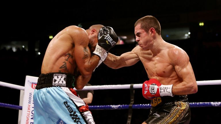 MANCHESTER, ENGLAND - NOVEMBER 24:  Scott Quigg (R) connects with Rendell Munroe during their Super Bantamweight bout at the MEN Arena on November 24, 2012