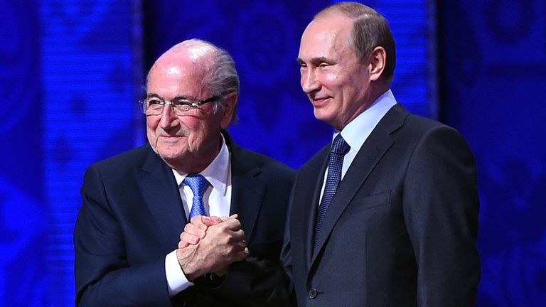 Sepp Blatter shakes hands with Vladimir Putin