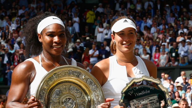 Serena Williams and Garbine Muguruza with their respective trophies