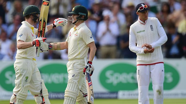Chris Rogers of Australia celebrates his century with team-mate Steve Smith
