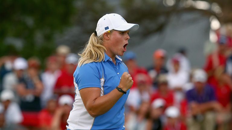 Caroline Hedwall celebrates after making a putt to win her match and retain the Solheim Cup in 2013