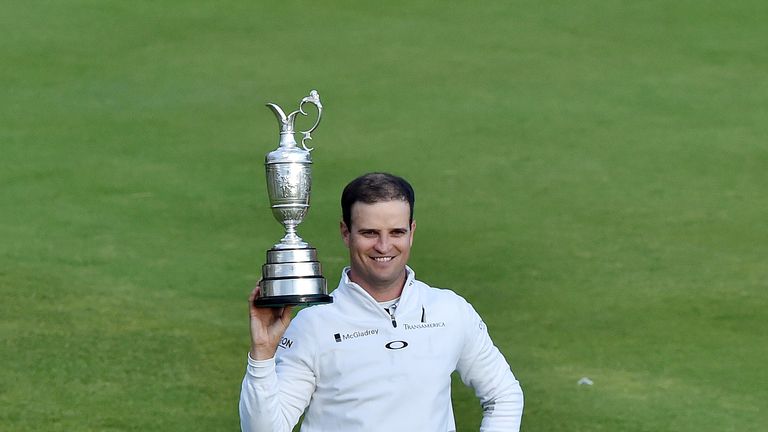 USA's Zach Johnson poses with the Claret Jug after winning the 144th Open