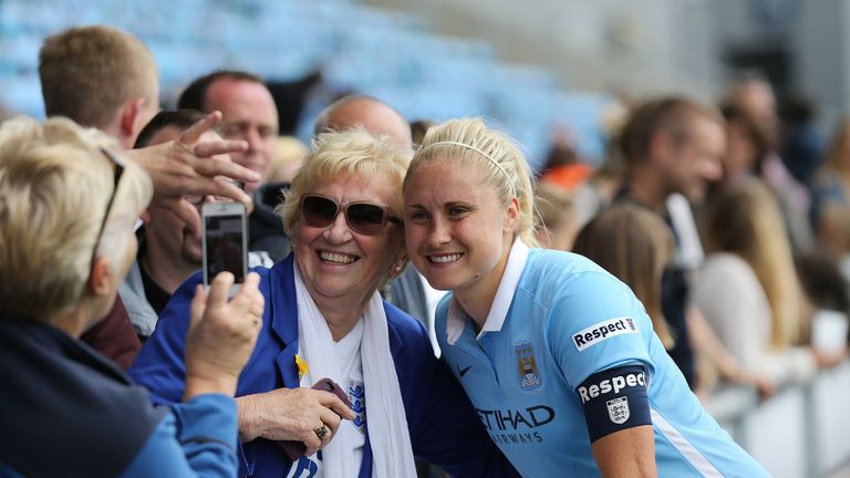 Manchester City Women's captain Steph Houghton signs autographs for fans at the end of the game against Birmingham City Ladies