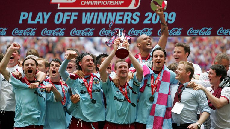 Steven Caldwell holds the Championship Play-Off trophy aloft after captaining Burnley to victory in 2009.