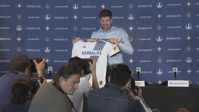 Steven Gerrard poses with his LA Galaxy shirt