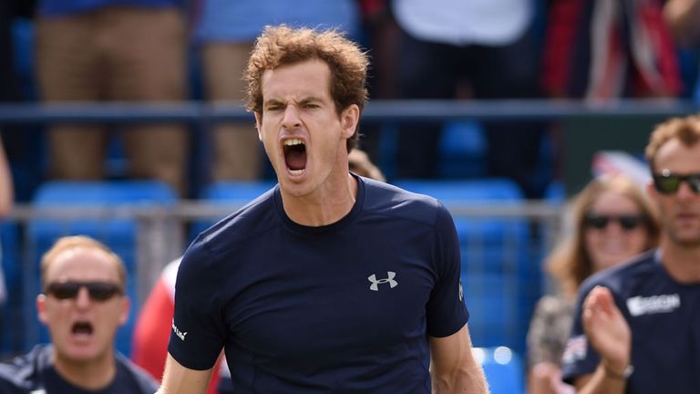 Great Britain's Andy Murray celebrates winning the third set of his doubles match