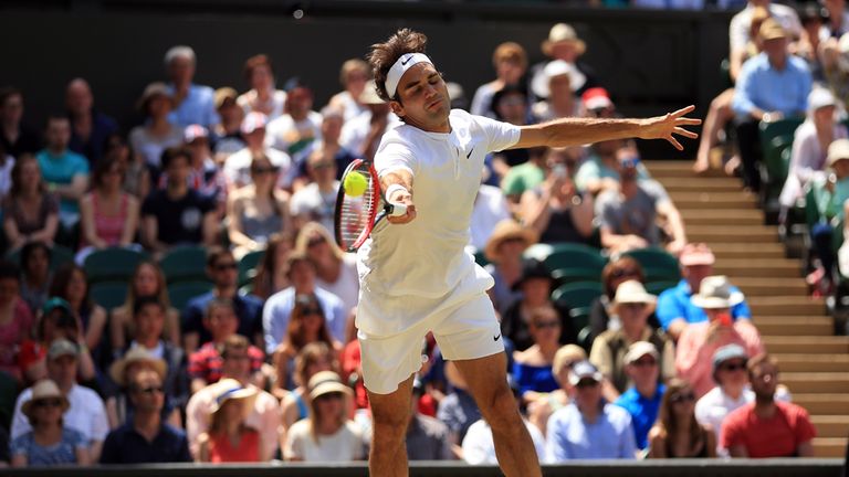 Roger Federer in action against Sam Groth during day Six of the Wimbledon Championships at the All England Lawn Tennis and Croquet Club, Wimbledon.