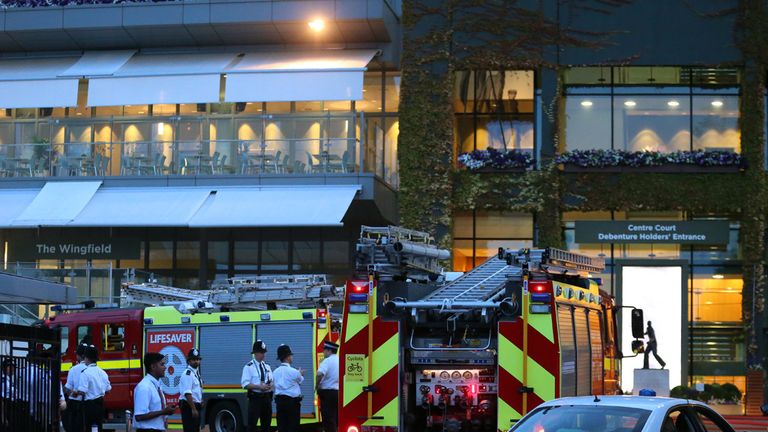 Fire Engines can be seen following an evacuation of centre court during day Three of the Wimbledon Championships