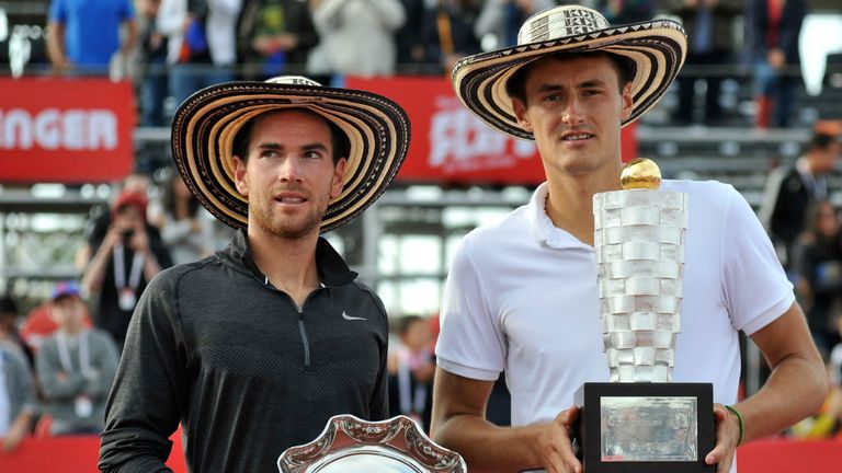 Bernard Tomic (R) and French player Adrian Mannarino (L) hold their pose with their trophies in Bogota, Colombia