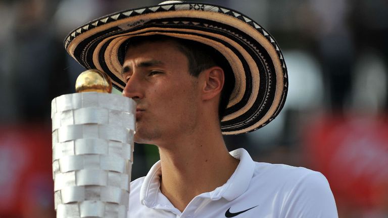 Bernard Tomic kisses his trophy after beating French player Adrian Mannarino in the ATP 250 Bogota