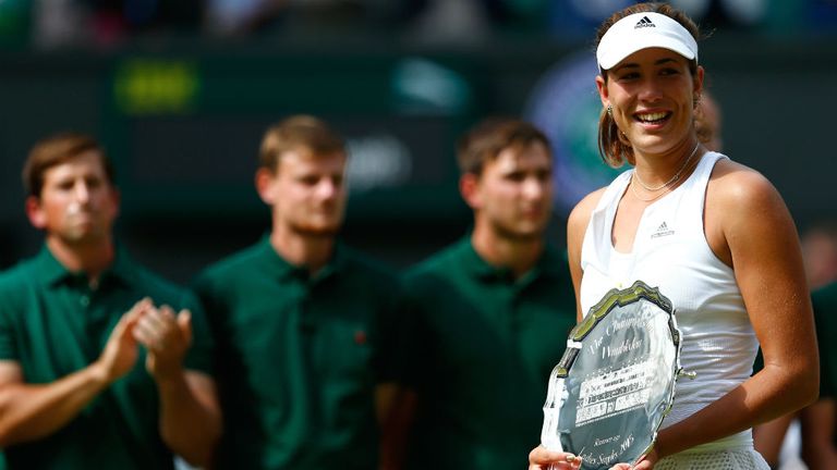 Garbine Muguruza poses with the runner-up trophy after the Final Of The Ladies' Singles against Serena Williams at Wimbledon