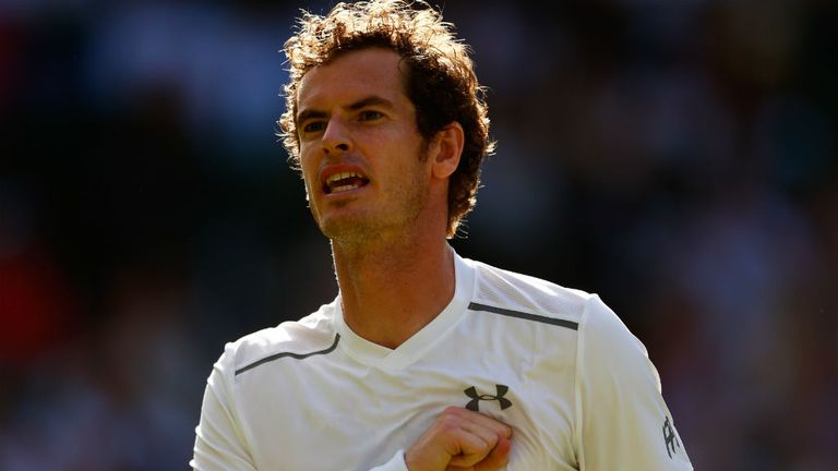 Andy Murray celebrates a point against Ivo Karlovic at Wimbledon
