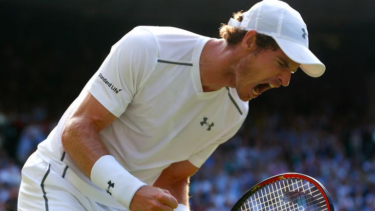 Andy Murray shouts as he celebrates winning a point against Roger Federer at Wimbledon