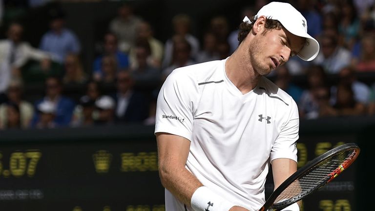 Andy Murray reacts against Roger Federer during Wimbledon