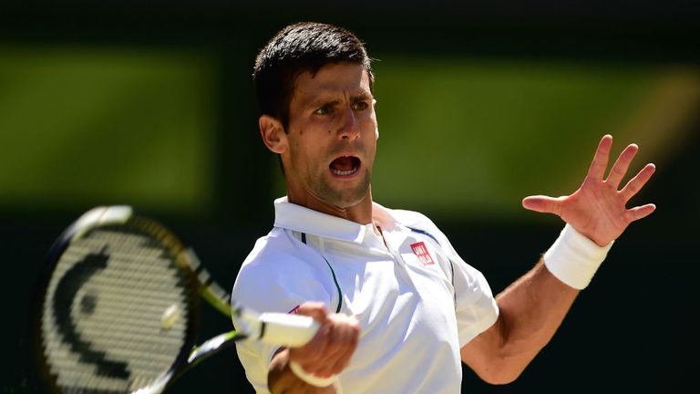 Novak Djokovic plays a backhand in the Semi Final match against Richard Gasquet at Wimbledon 
