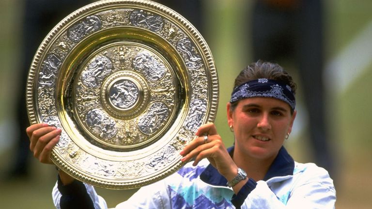 Conchita Martinez holds the trophy after her victory in the Womens Singles Final at Wimbledon in 1994