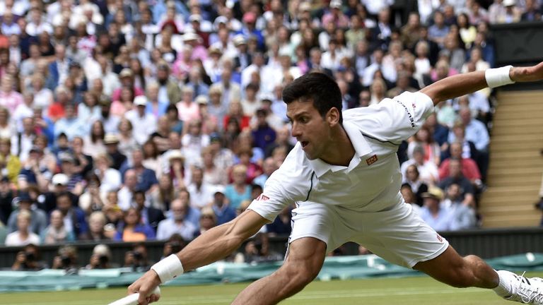 Novak Djokovic returns to Roger Federer during their men's singles final match in the 2015 Wimbledon final