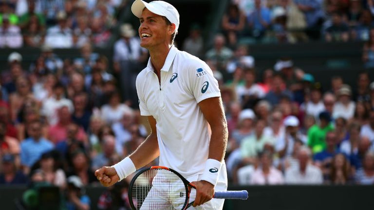 Vasek Pospisil celebrates after winning against James Ward at Wimbledon 