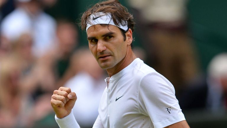 Roger Federer reacts after winning the second set against Novak Djokovic during the 2015 Wimbledon final