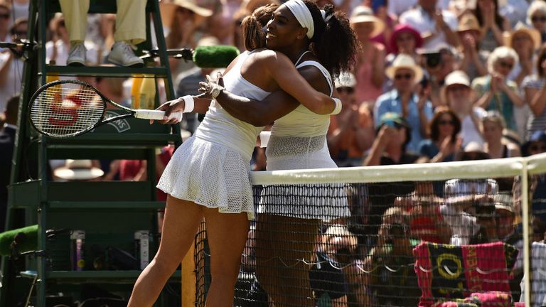Serena Williams (R) embraces Spain's Garbine Muguruza (L) at the net at 2015 Wimbledon