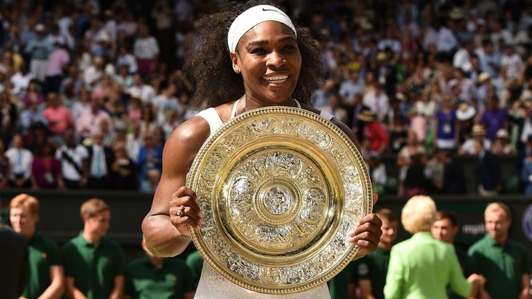 Serena Williams celebrates with the winner's trophy after victory over Spain's Garbine Muguruza at Wimbledon