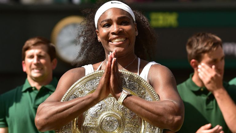 Serena Williams celebrates with the winner's trophy after victory over Spain's Garbine Muguruza at Wimbledon
