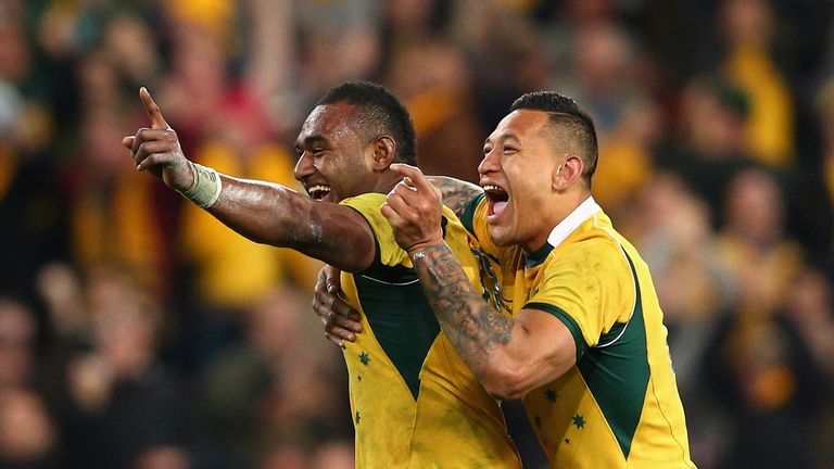 Tevita Kuridrani of the Wallabies celebrates scoring the winning try with team mate Israel Folau