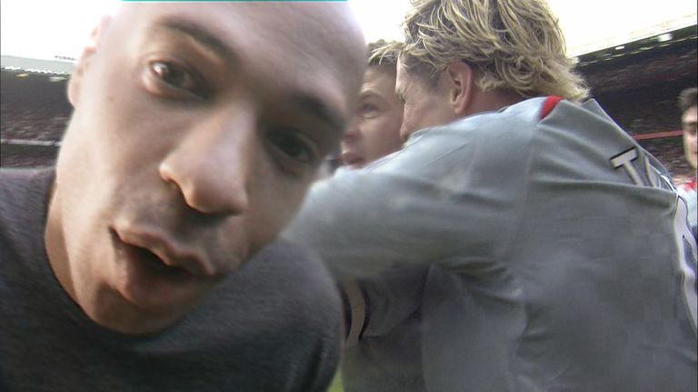 Thierry Henry gatecrashes Liverpool's celebrations at Old Trafford in 2009 - when Steven Gerrard famously kissed the cameran