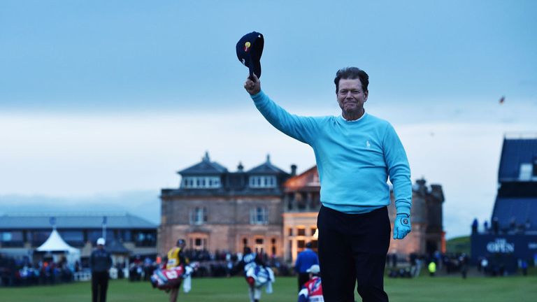 Tom Watson of the United States waves to the crowd from Swilcan Bridge in honor of his final Open Championship appearance 
