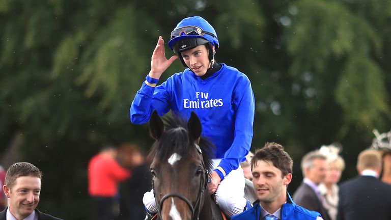 James Doyle salutes the crowd as he returns to the winner's enclosure on Toormore