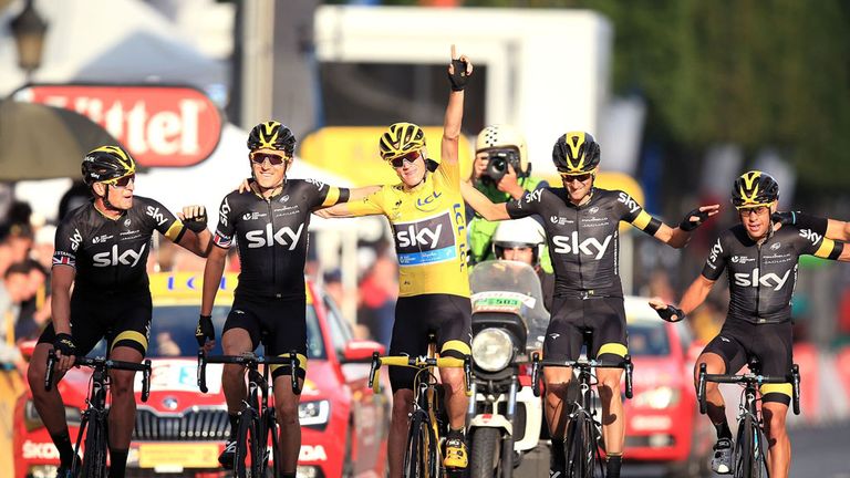 Team Sky's Chris Froome (yellow jersey) crosses the finish line with teammates during Stage Twenty One of the 2015 Tour de France between Sevres and Paris 