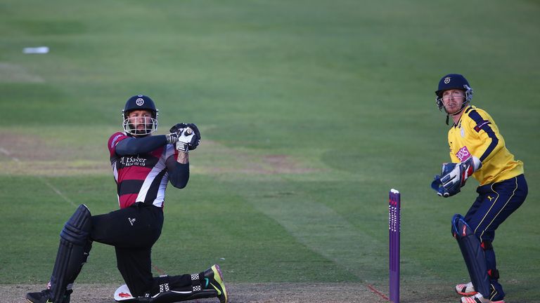 Peter Trego clears the ropes only to be caught by a fan