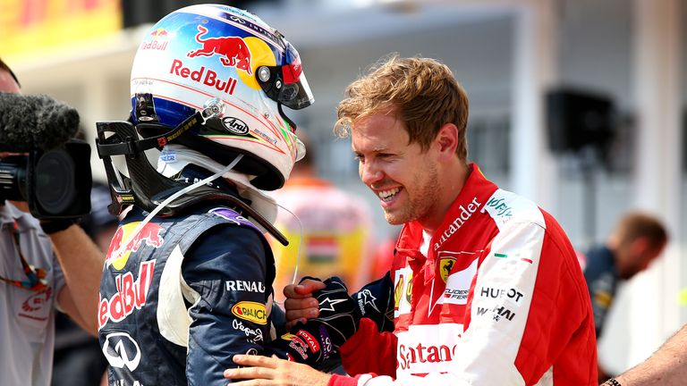 Sebastian Vettel (right) and Daniel Ricciardo (left) embrace after qualifying