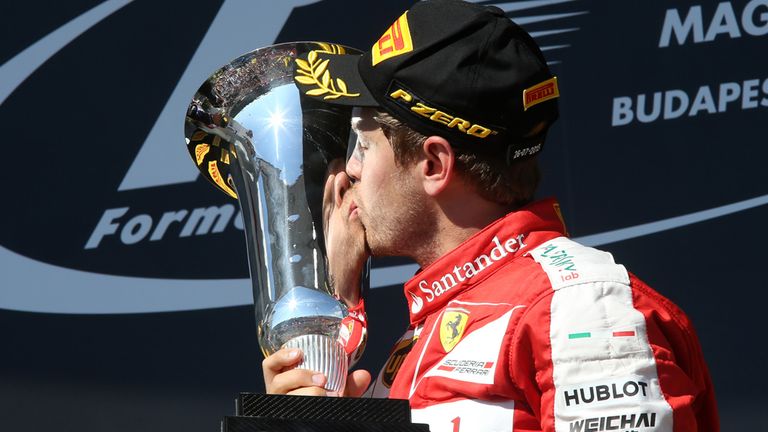 Hungarian GP winner Sebastian Vettel of Ferrari celebrates