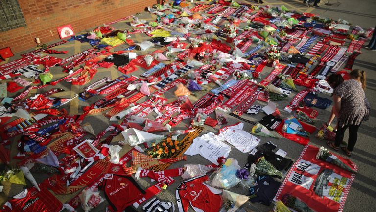 Flowers and football tributes are laid outside Walsall Football Club in memory of, Adrian Evans, Patrick Evans and Joel Richards