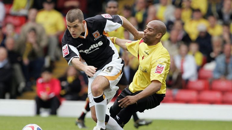 Marlon King of Watford is beaten to the ball by John Welsh of Hull during the Coca-Cola Championship match between the two in 2006