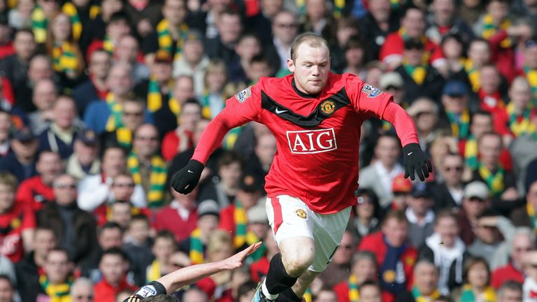 MANCHESTER - MARCH 21 2010: Wayne Rooney of Manchester United clashes with Jamie Carragher of Liverpool during the FA Barclays Premier League match 