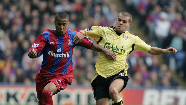 Wayne Routledge of Crystal Palace battles with John Welsh of Liverpool during a Premier League match