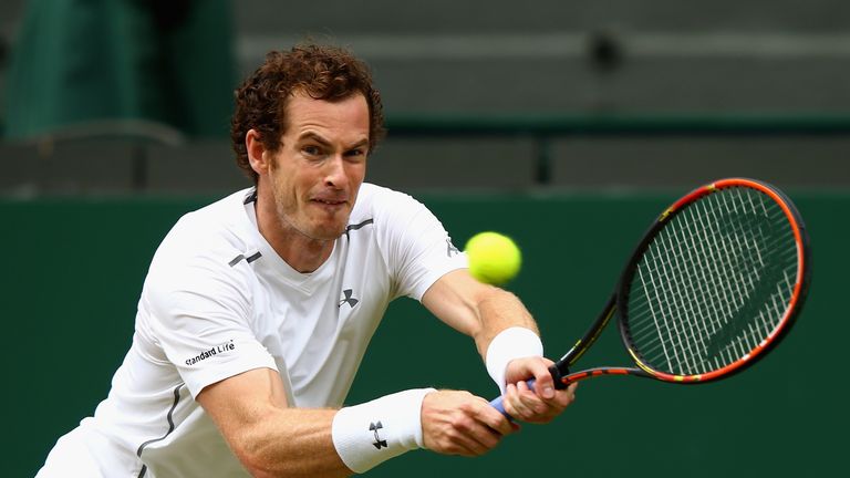 Andy Murray of Great Britain plays a backhand in his Gentlemens Singles Quarter Final match against Vasek Pospisil at Wimbledon