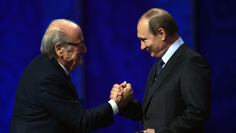SAINT PETERSBURG, RUSSIA - JULY 25:  FIFA President Joseph S. Blatter shakes hands with Vladimir Putin, President of Russia during the Preliminary Draw of 