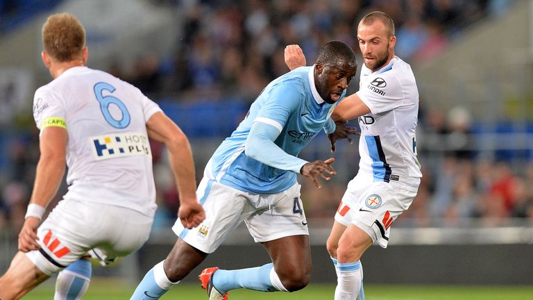 Yaya Toure of Manchester City takes on the Melbourne City defence