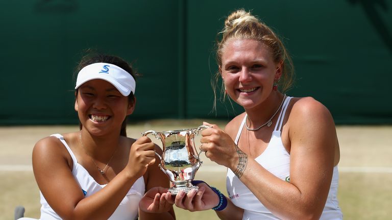 Yui Kamiji of Japan and Jordanne Whiley of Great Britain pose with the trophy after winning the  Wheelchair Ladies Doubles Fina