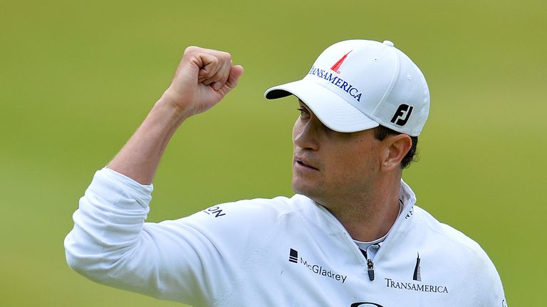 US golfer Zach Johnson celebrates making his birdie putt on the 18th green during his final round 66, on day five of 