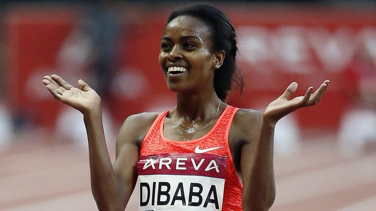 Ethiopia's Genzebe Dibaba celebrates after winning the women's 5000m during the IAAF Diamond League athletics meeting at the Stade de France in Saint-Denis