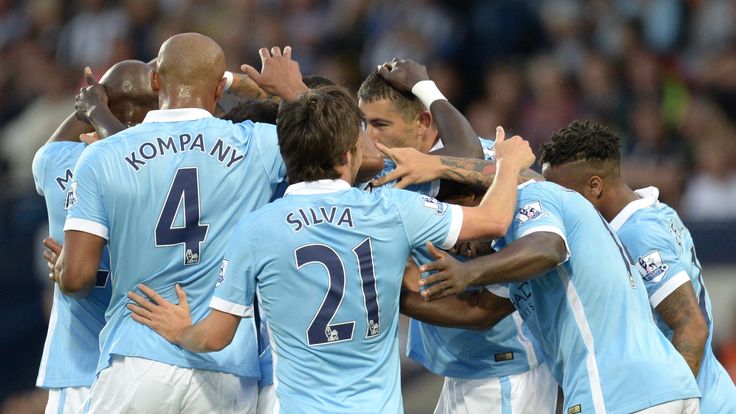 Manchester City's Ivorian midfielder Yaya Toure celebrates with teammates after scoring against West Bromwich Albion on August 10, 2015