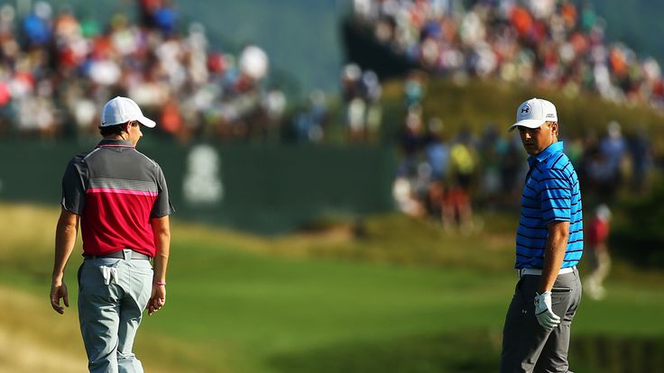 Rory McIlroy of Northern Ireland walks with Jordan Spieth of the United States up the 11th fairway during the second round of the PGA