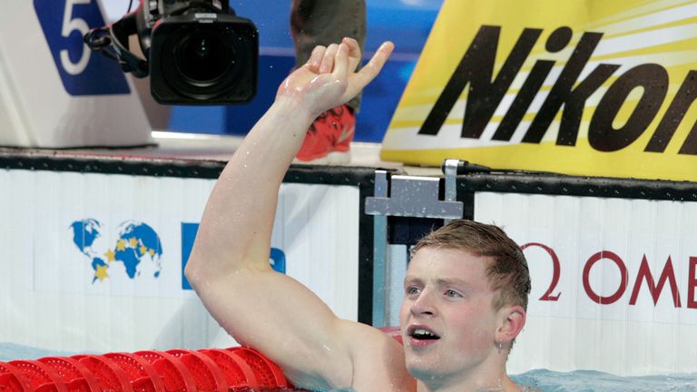 Adam Peaty celebrates his 50m breaststroke world record