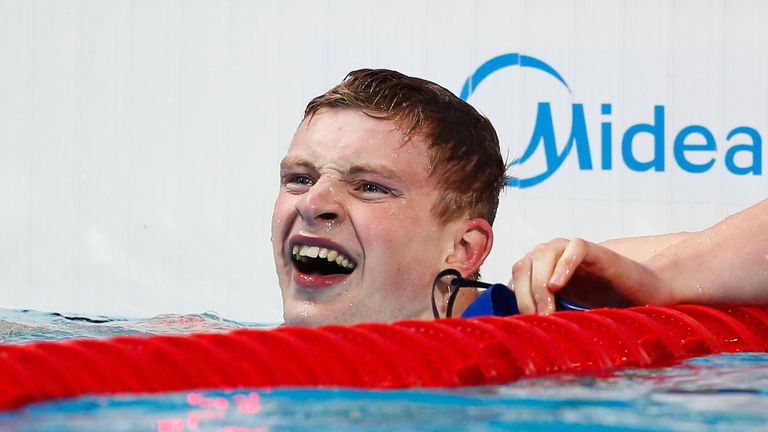 Adam Peaty celebrates after claiming gold in Kazan