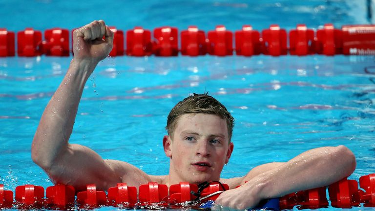 Adam Peaty celebrates after winning gold in the 50m breaststroke